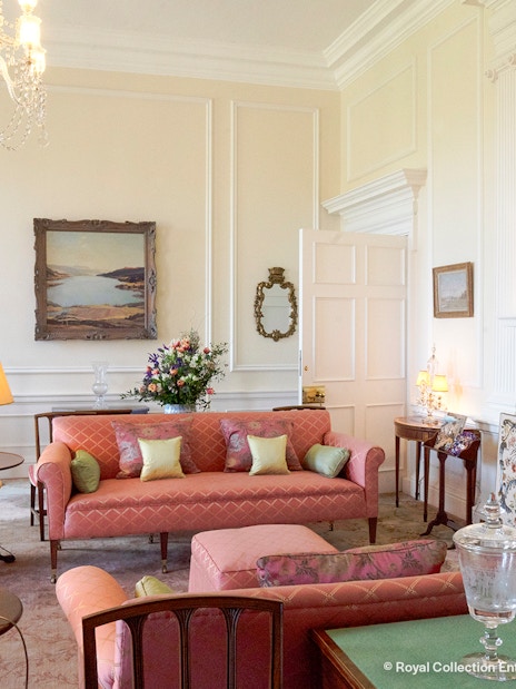 Queen Elizabeth II's private sitting room at Palace of Holyroodhouse with elegant decor.
