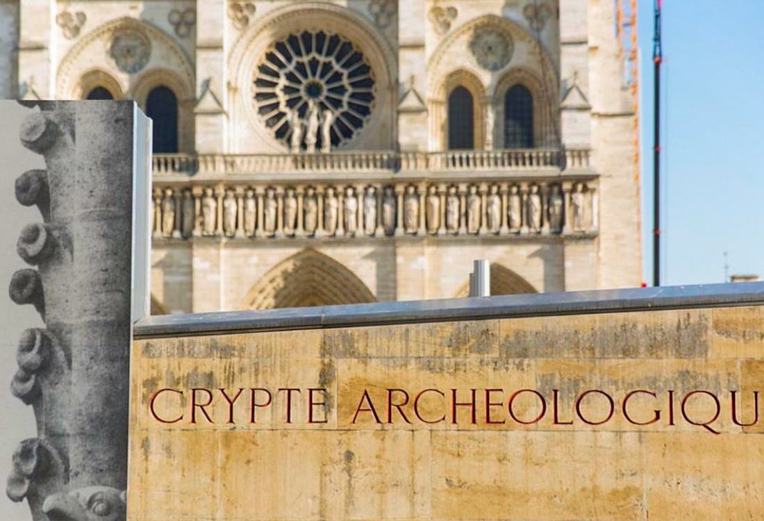 Notre-Dame Archaeological Crypt entrance with historical artifacts displayed