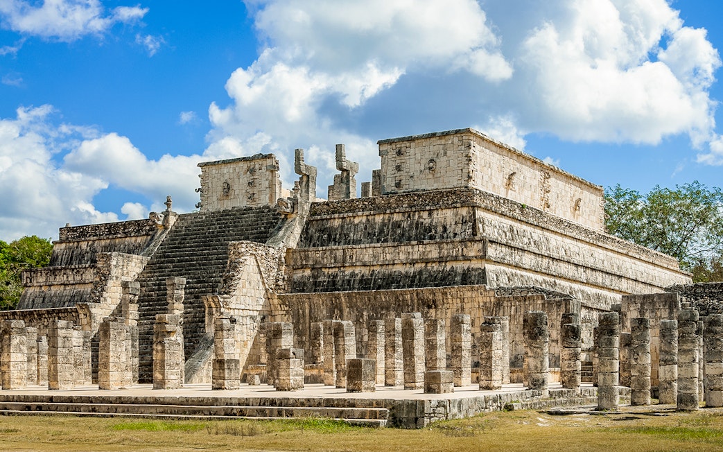 Temple of the Warriors with stone columns and steps in Chichen Itza, Mexico.