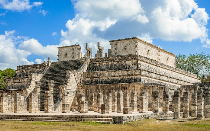 Temple of the Warriors with stone columns and steps in Chichen Itza, Mexico.
