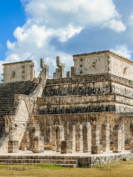 Temple of the Warriors with stone columns and steps in Chichen Itza, Mexico.