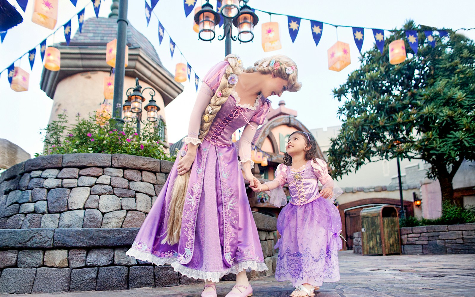 Princess and child in purple dresses at Disney's Hollywood Studios, Orlando.