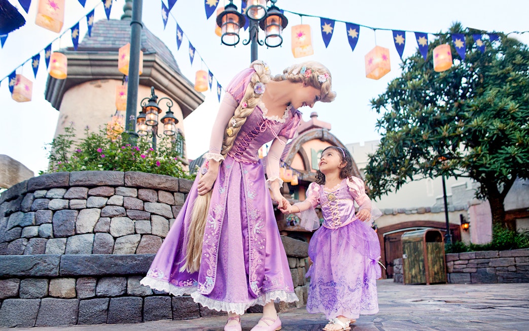Princess and child in purple dresses at Disney's Hollywood Studios, Orlando.