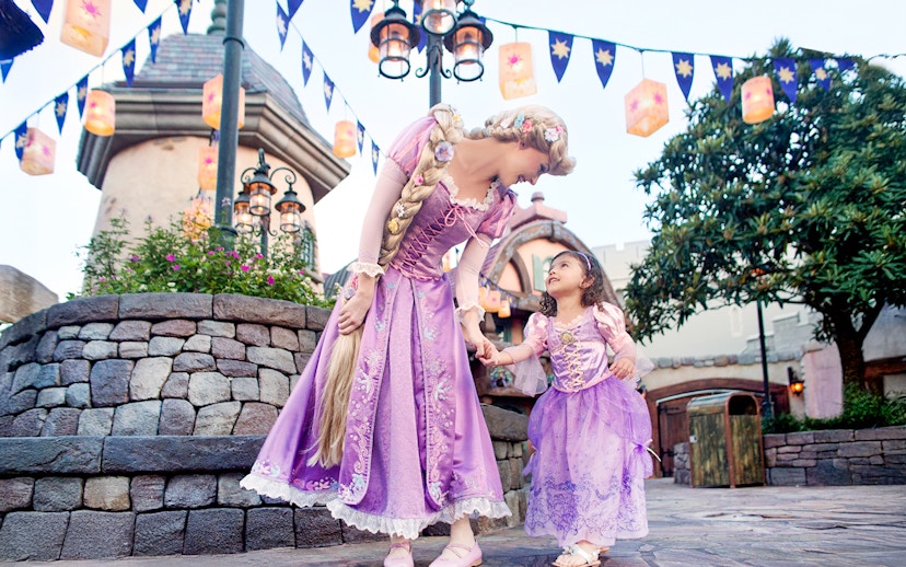 Princess and child in purple dresses at Disney's Hollywood Studios, Orlando.