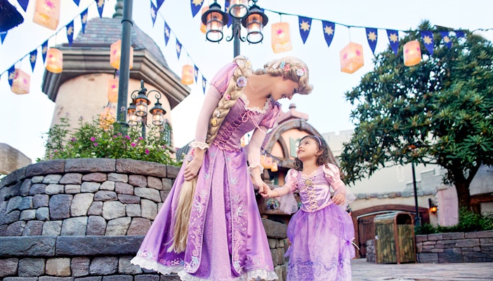 Princess and child in purple dresses at Disney's Hollywood Studios, Orlando.
