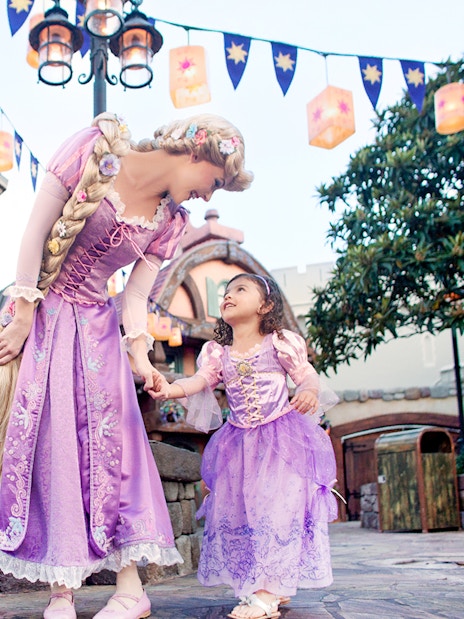 Princess and child in purple dresses at Disney's Hollywood Studios, Orlando.