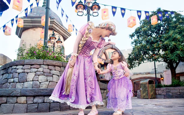Princess and child in purple dresses at Disney's Hollywood Studios, Orlando.