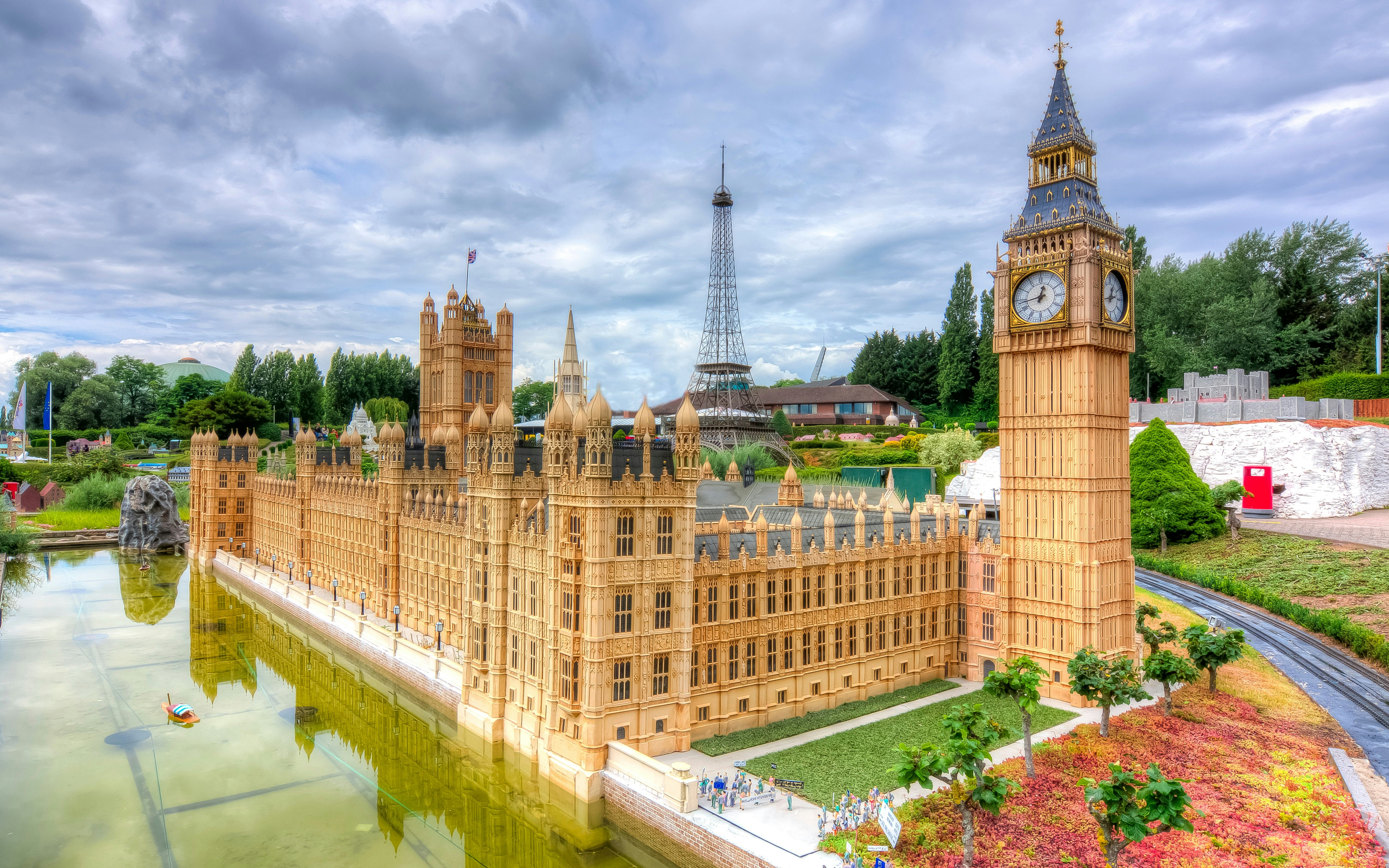 Miniature Big Ben and Westminster Palace with Eiffel Tower in Mini Europe Park, Brussels.