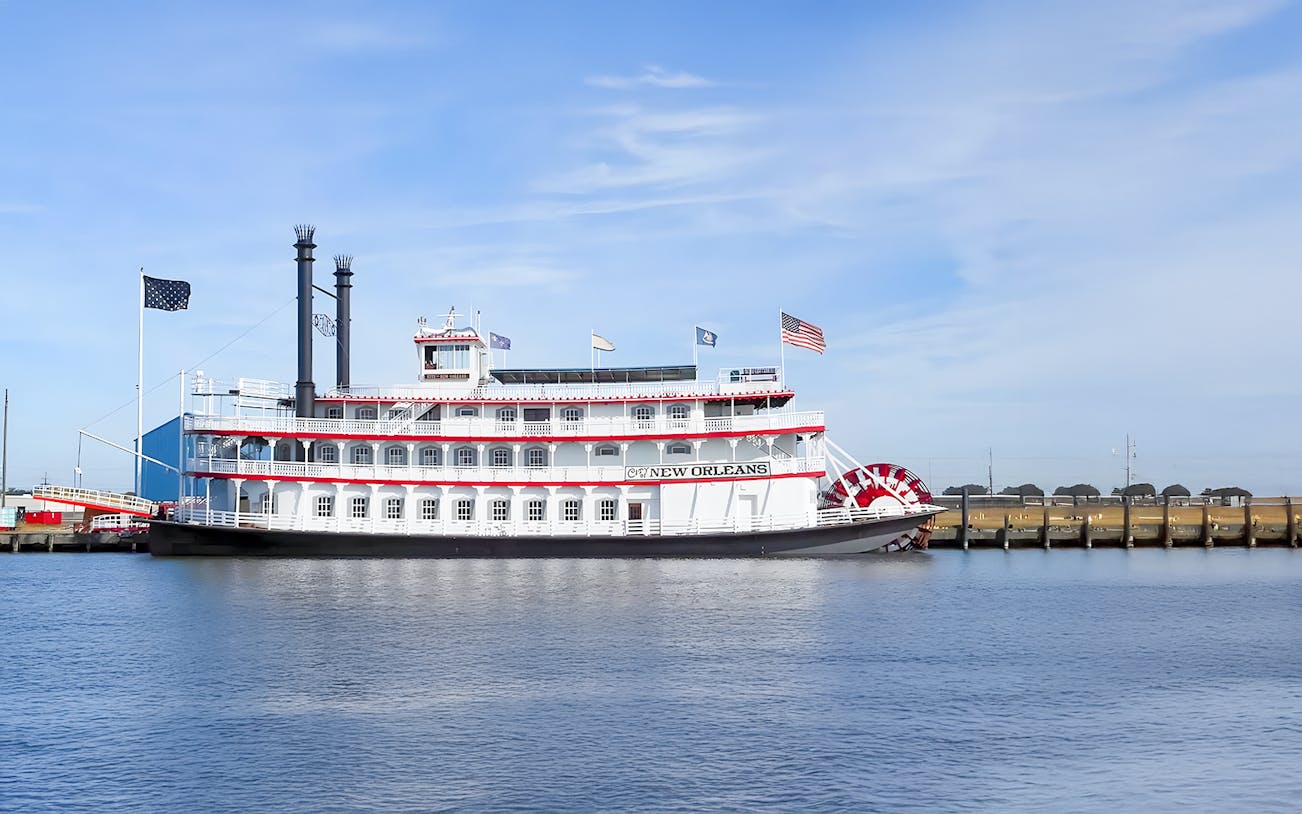 Steamboat Natchez cruising on the Mississippi River, New Orleans, with paddlewheel in motion.