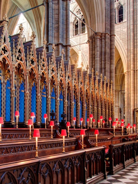 Westminster Abbey interior with ornate choir stalls and altar, Royal London Tour.