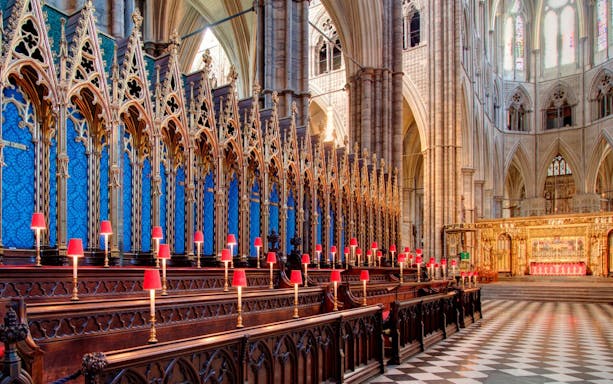 Westminster Abbey interior with ornate choir stalls and altar, Royal London Tour.