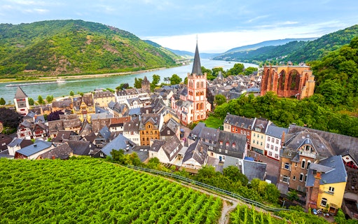 Bacharach old town with Stahleck Castle and Rhine River in the background.
