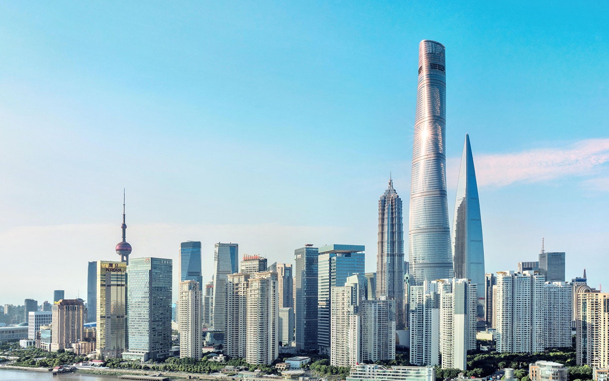 Shanghai skyline featuring the Shanghai Tower and surrounding skyscrapers.