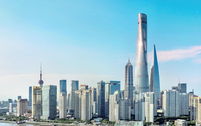 Shanghai skyline featuring the Shanghai Tower and surrounding skyscrapers.