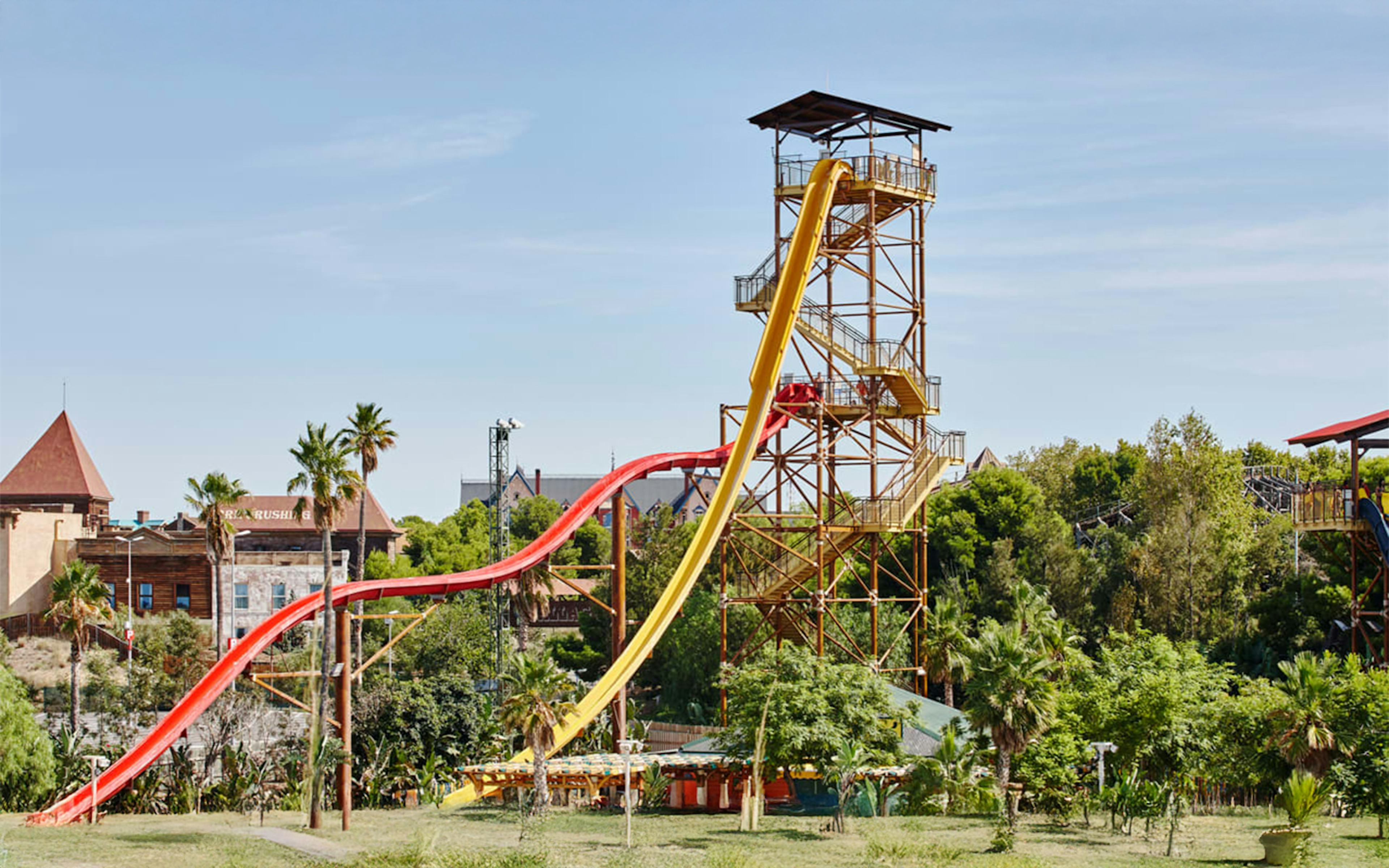 Huge poles coloured in yellow and red of King Khajuna ride