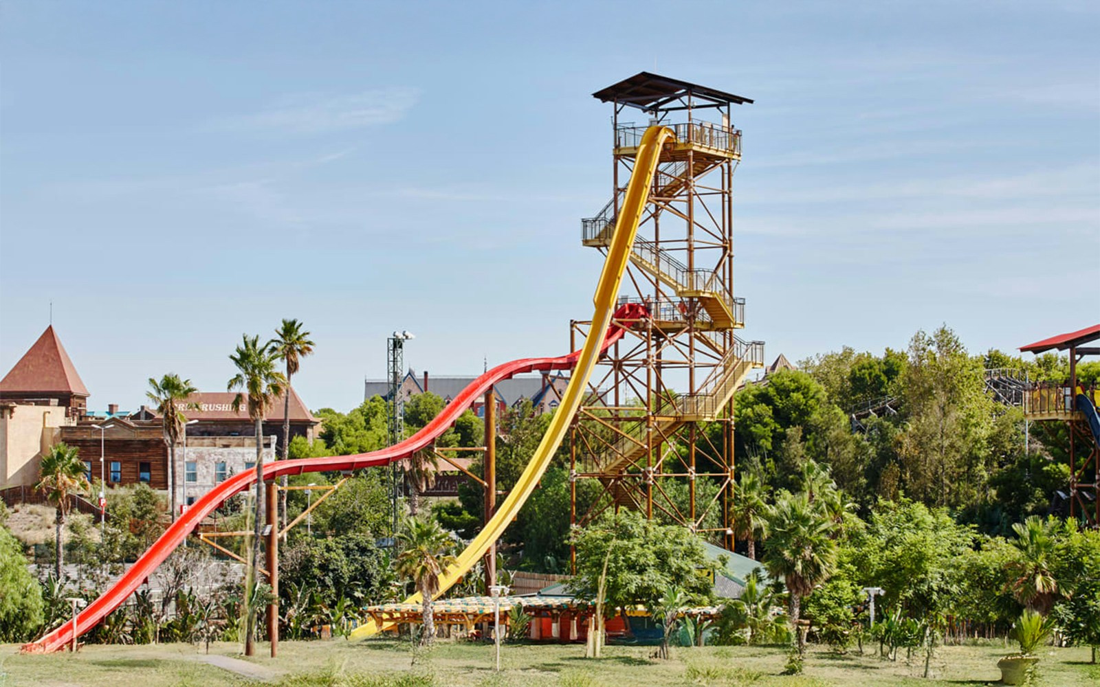 Huge poles coloured in yellow and red of King Khajuna ride