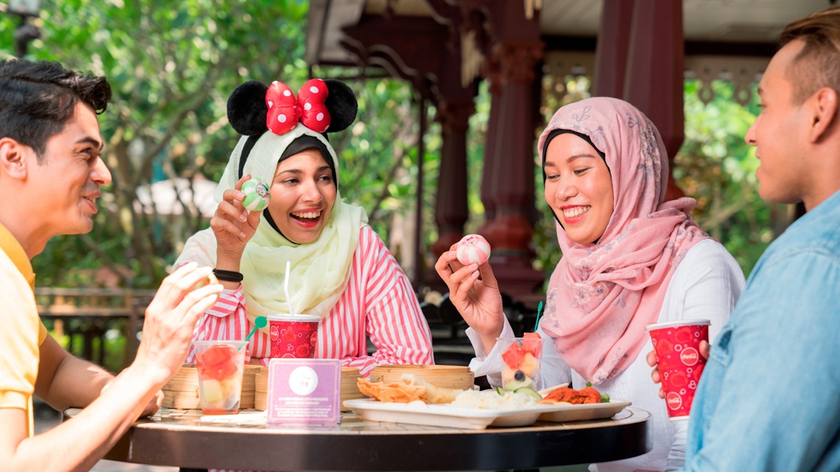 People enjoying food at Disneyland Hong Kong.