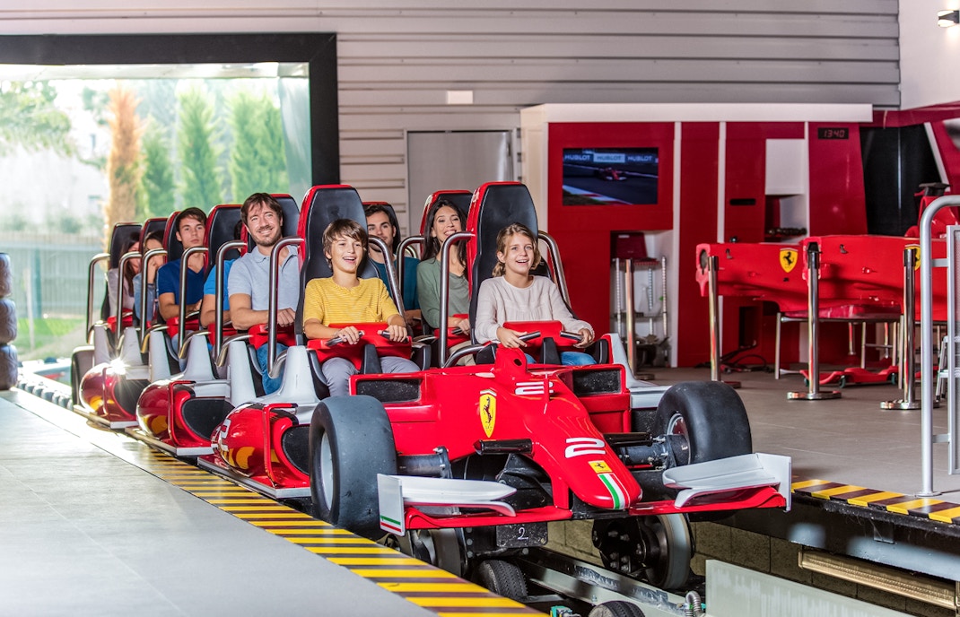 Tourists on a roller coaster at Ferrari Land, PortAventura, Spain.