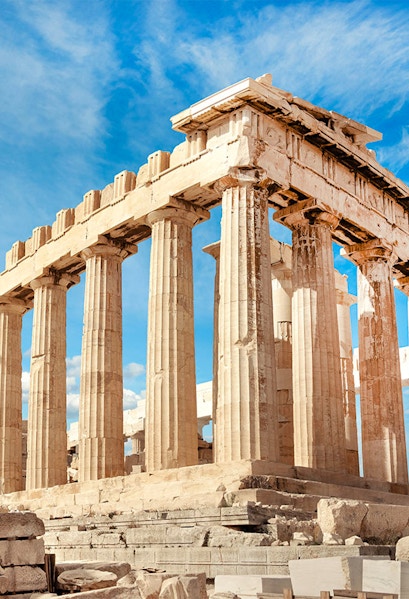 Parthenon columns under blue sky in Athens, Greece.