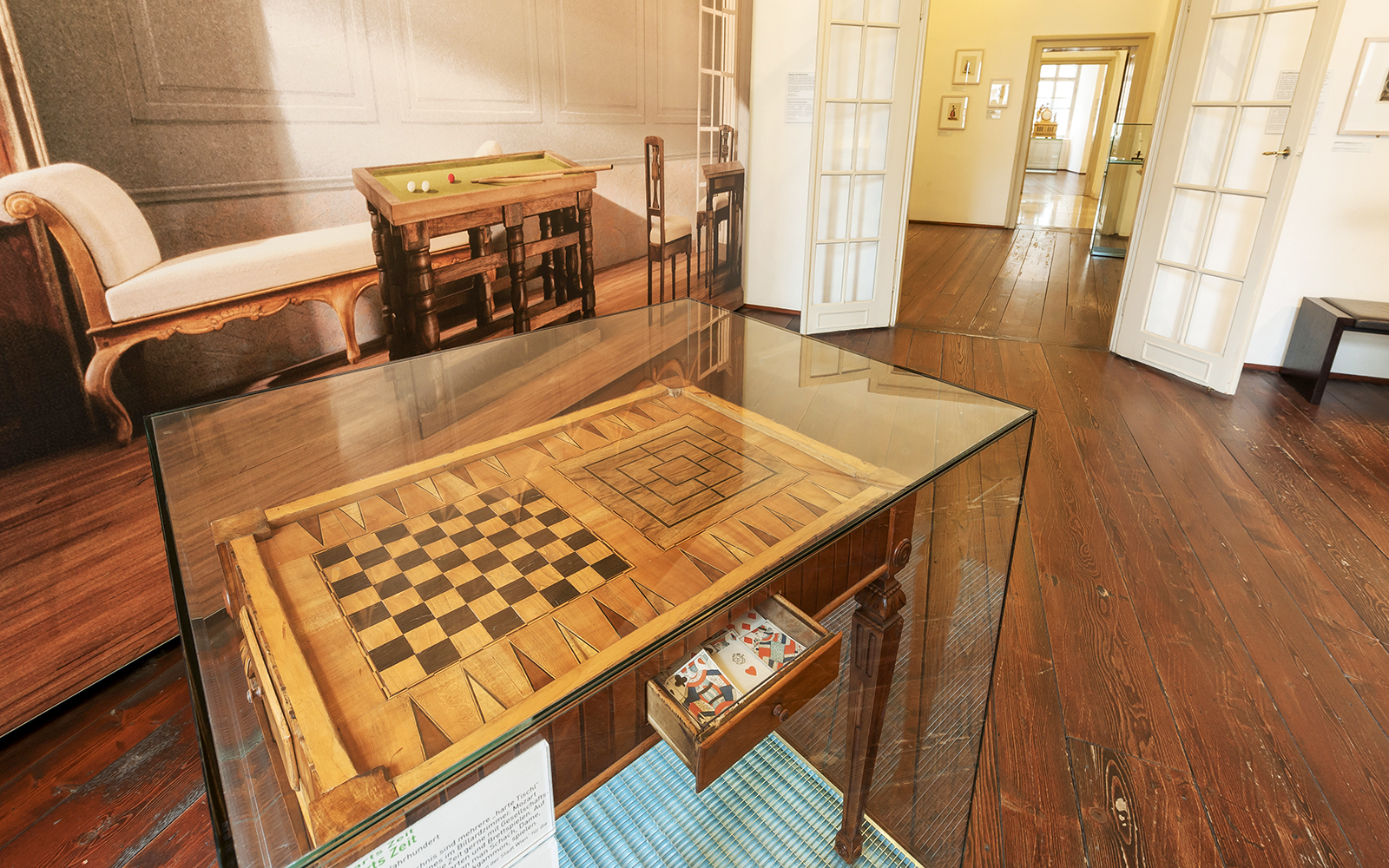 Mozarthaus Vienna interior with historical game table display.