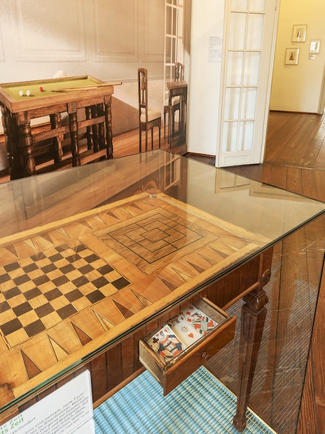 Mozarthaus Vienna interior with historical game table display.