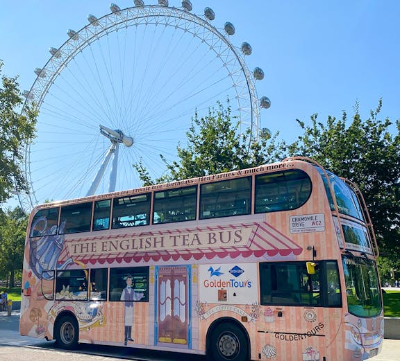 Golden Tours London bus near the London Eye, offering hop-on hop-off tickets.