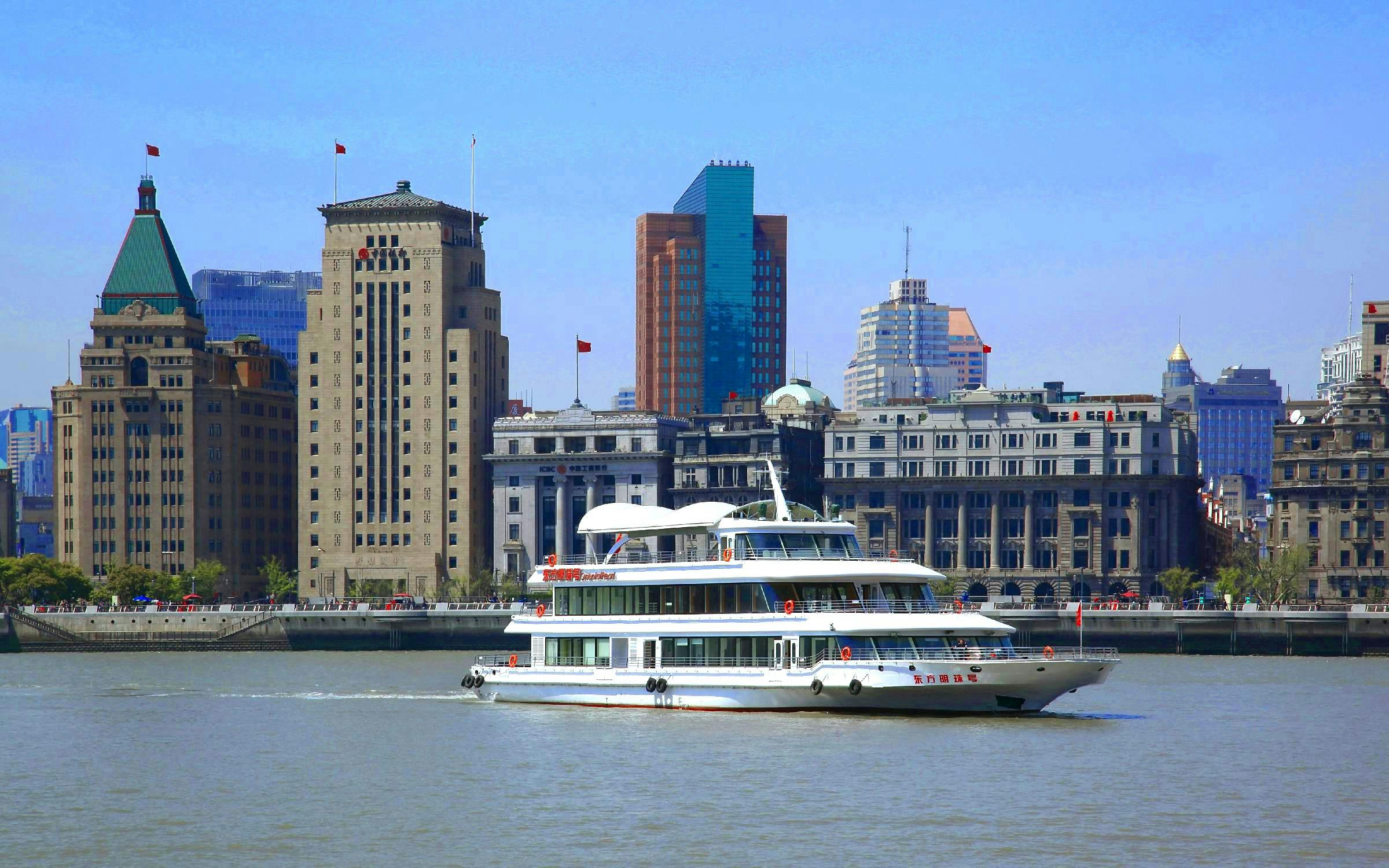 Cruise on Huangpu River with Shanghai skyline including World Financial Centre.