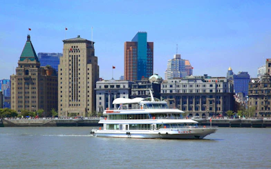 Cruise on Huangpu River with Shanghai skyline including World Financial Centre.