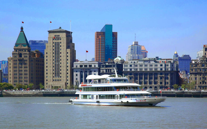 Cruise on Huangpu River with Shanghai skyline including World Financial Centre.