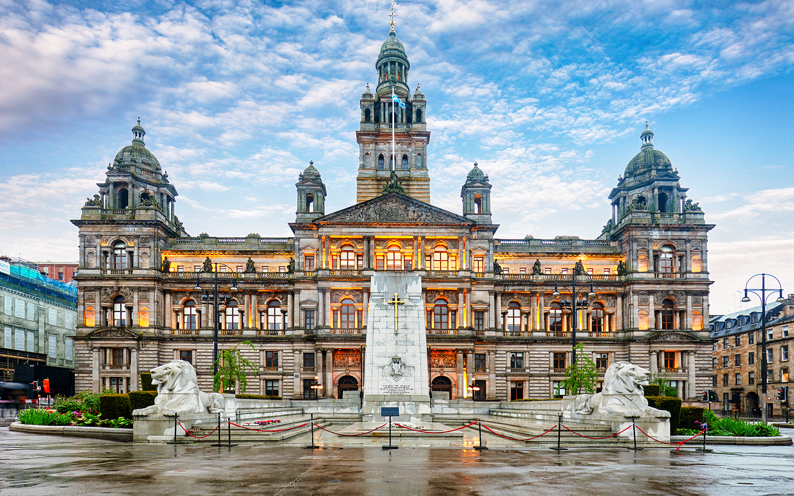 Glasgow City Chambers and George Square with statues in Glasgow, Scotland.