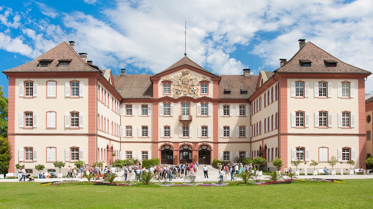 Castle on Mainau Flower Island with visitors in front, Germany.