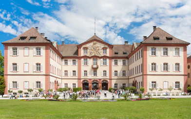 Castle on Mainau Flower Island with visitors in front, Germany.