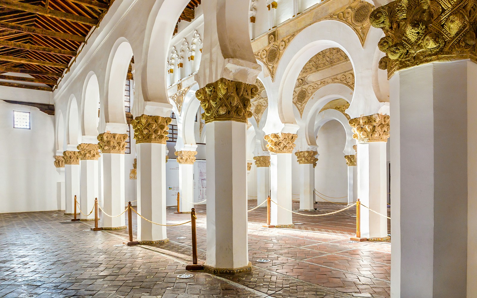 Synagogue of Santa Maria la Blanca, white pillars with golden floral capitals, Toledo.