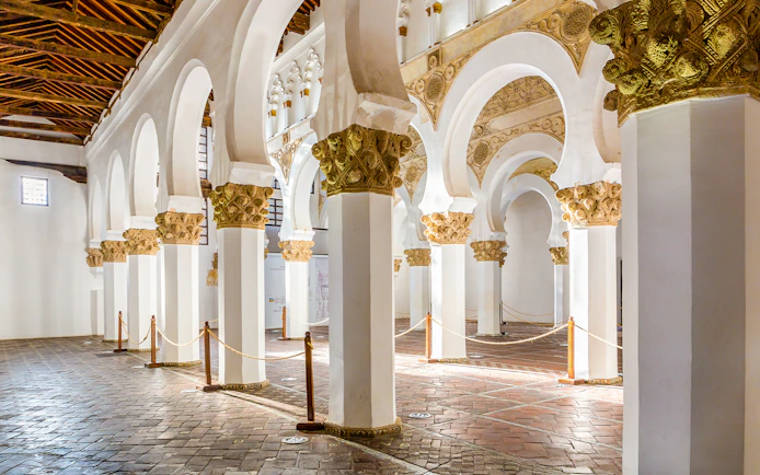 Synagogue of Santa Maria la Blanca, white pillars with golden floral capitals, Toledo.