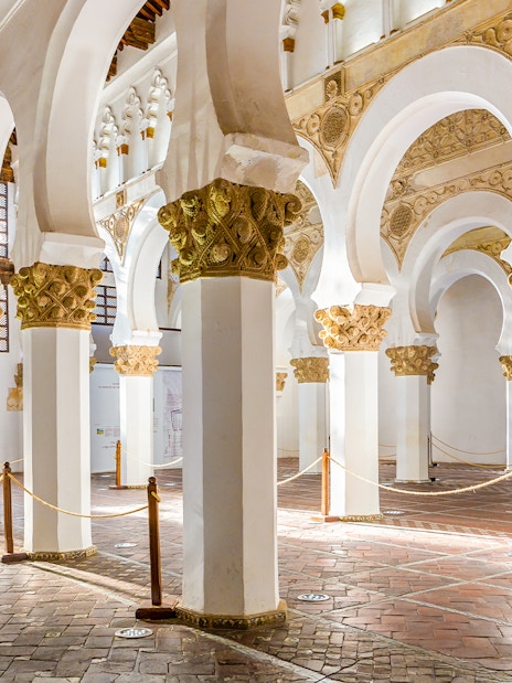Synagogue of Santa Maria la Blanca, white pillars with golden floral capitals, Toledo.