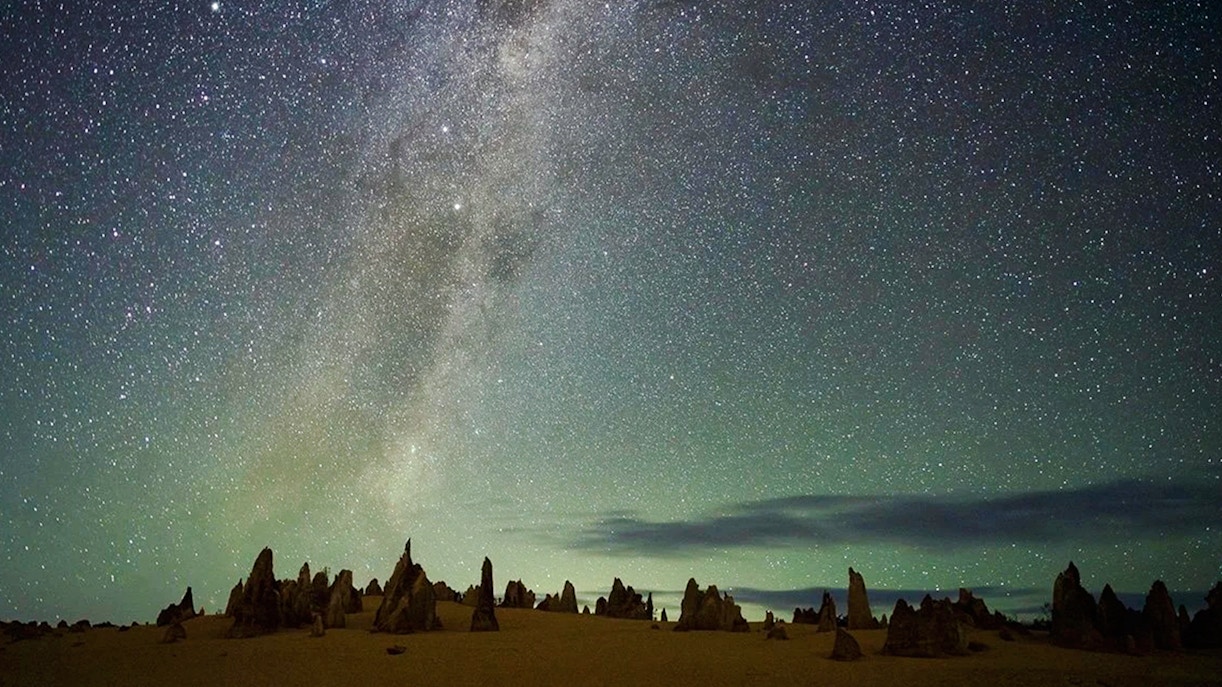 Pinnacles Desert under starry sky during sunset, ideal for stargazing and wildlife spotting tour.