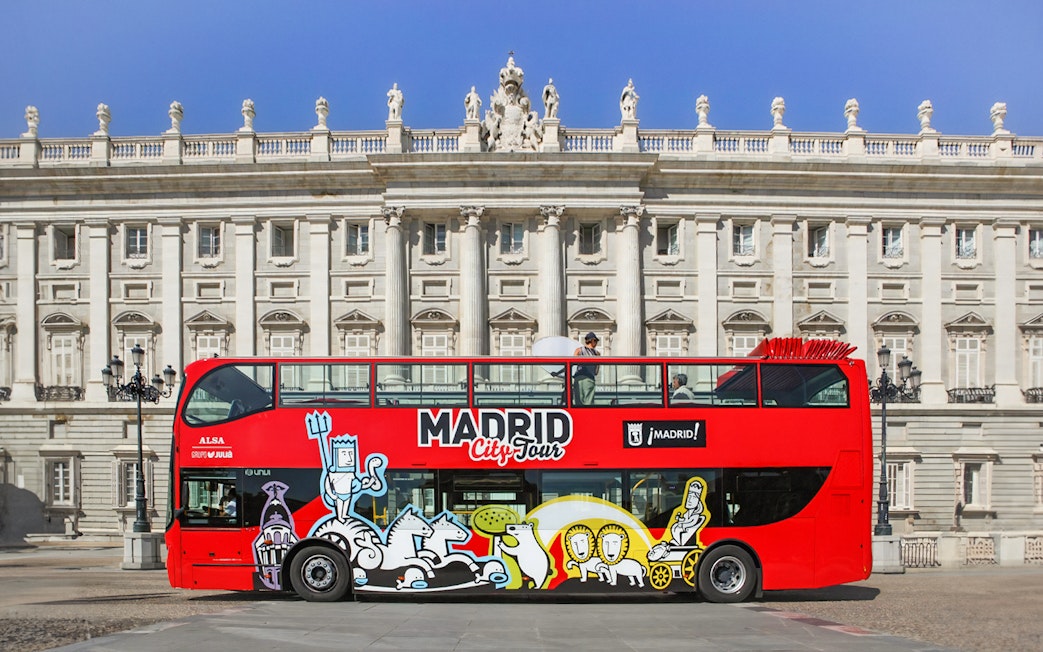 Hop-On Hop-Off bus in front of Madrid's Royal Palace.
