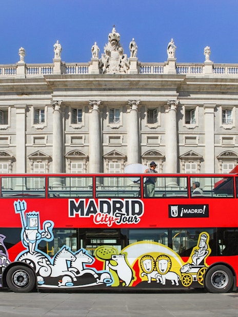 Hop-On Hop-Off bus in front of Madrid's Royal Palace.