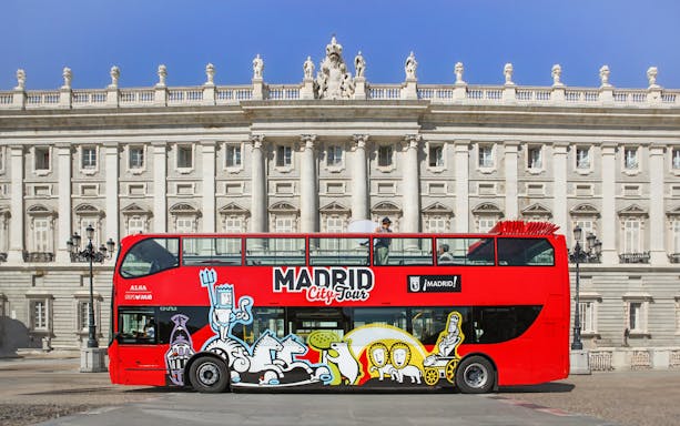 Hop-On Hop-Off bus in front of Madrid's Royal Palace.