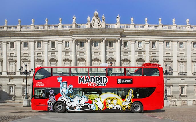 Hop-On Hop-Off bus in front of Madrid's Royal Palace.