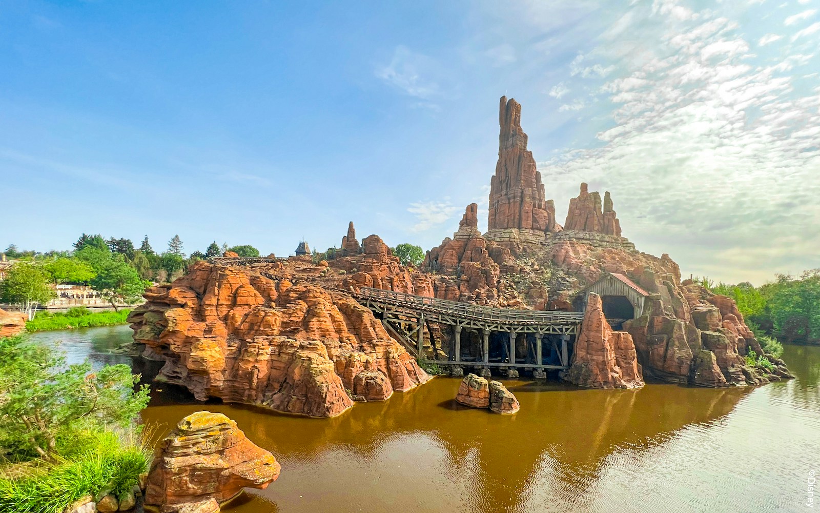 Frontierland's Big Thunder Mountain Railroad at Disneyland Paris with rocky landscape.
