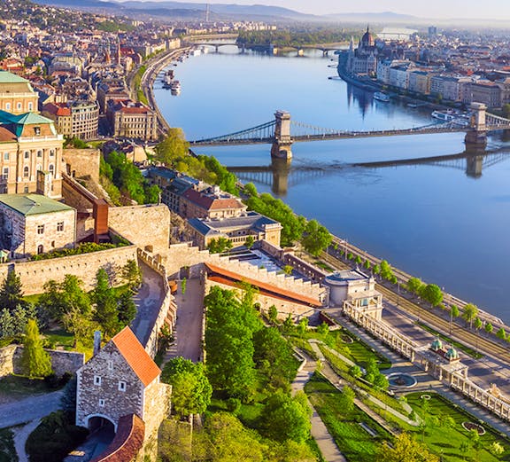 Aerial view of Budapest featuring the Danube River and Chain Bridge.