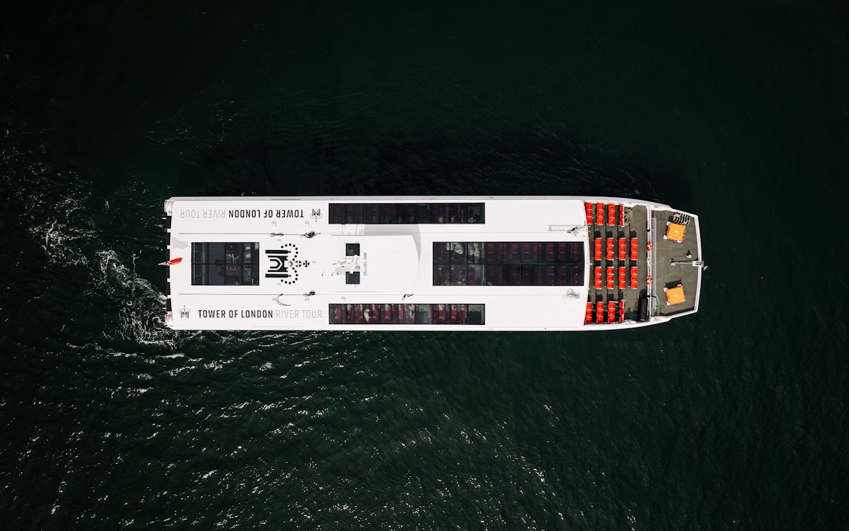 Aerial view of Tower of London river tour boat on the Thames.