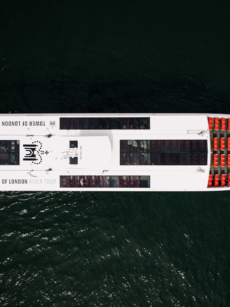 Aerial view of Tower of London river tour boat on the Thames.