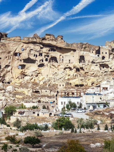 Cavusin village rock formations and ancient dwellings in Cappadocia, Turkey.