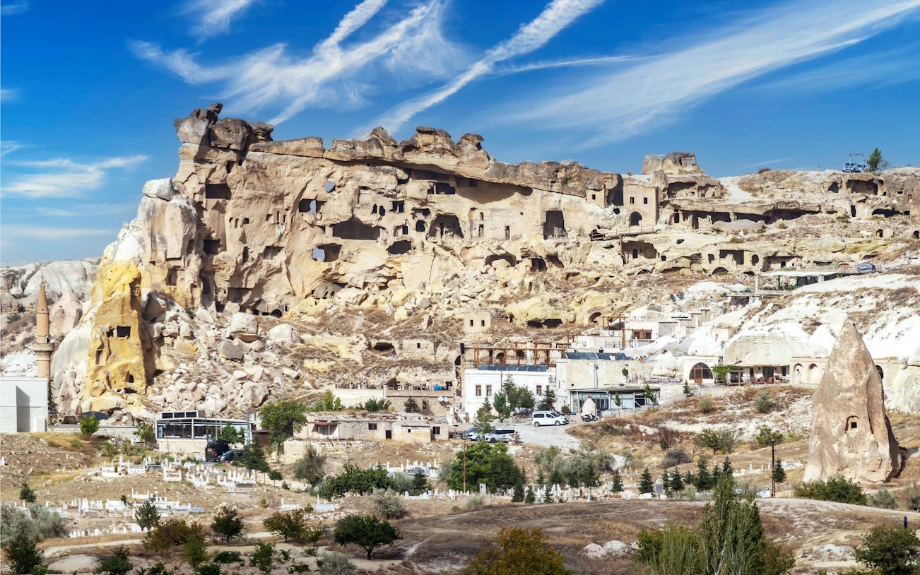 Cavusin village rock formations and ancient dwellings in Cappadocia, Turkey.
