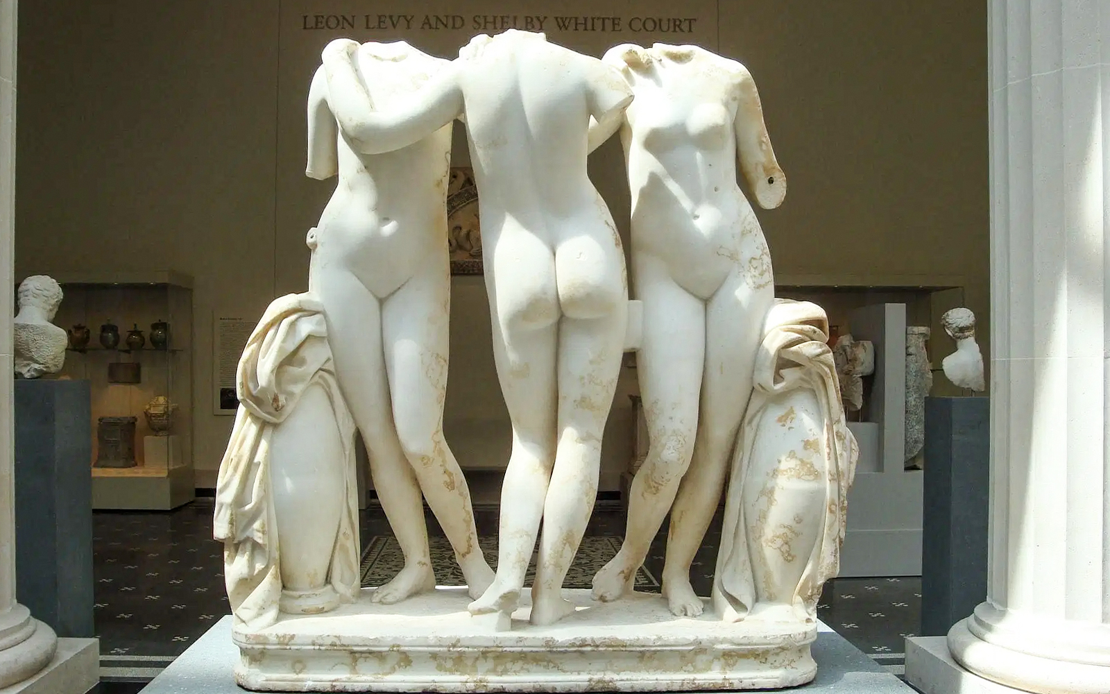 Three marble statues in The Met Museum's Leon Levy and Shelby White Court.
