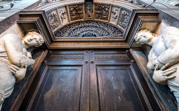 Ornate entrance with sculptures at Doge's Palace, Venice, part of 3 Museum Pass tour.