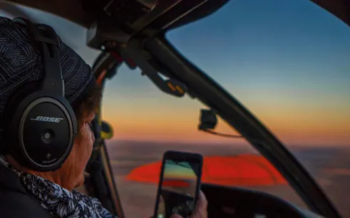 Helicopter view of Uluru at sunset during 25-minute Uluru & Kata Tjuta tour.