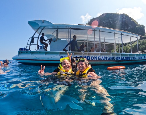 Tourists snorkeling in clear blue waters at Nusa Lembongan & Manta Bay Snorkeling Day Tour in Bali